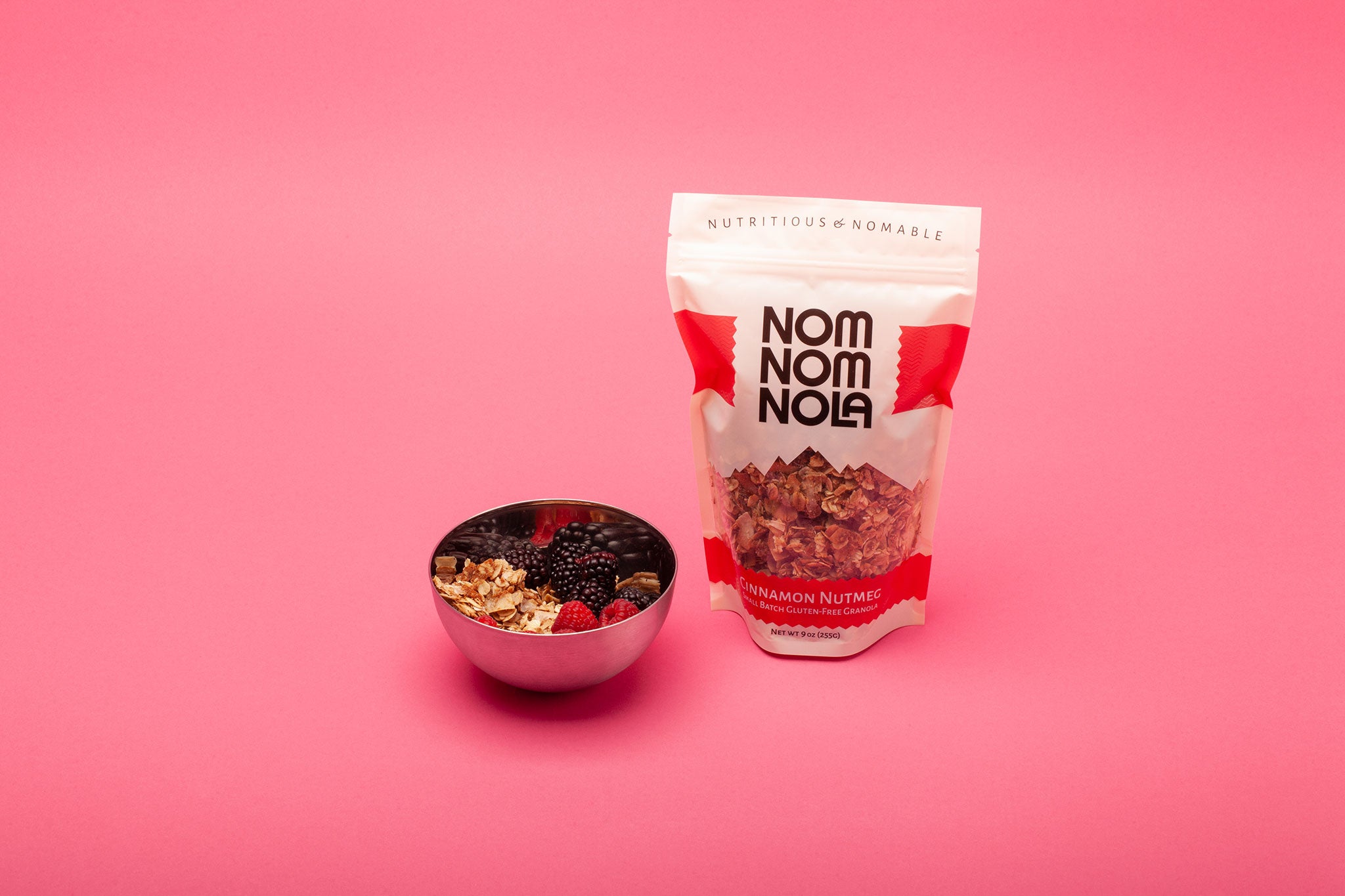 Cinnamon Nutmeg Nom Nom Nola Granola next to Acai bowl