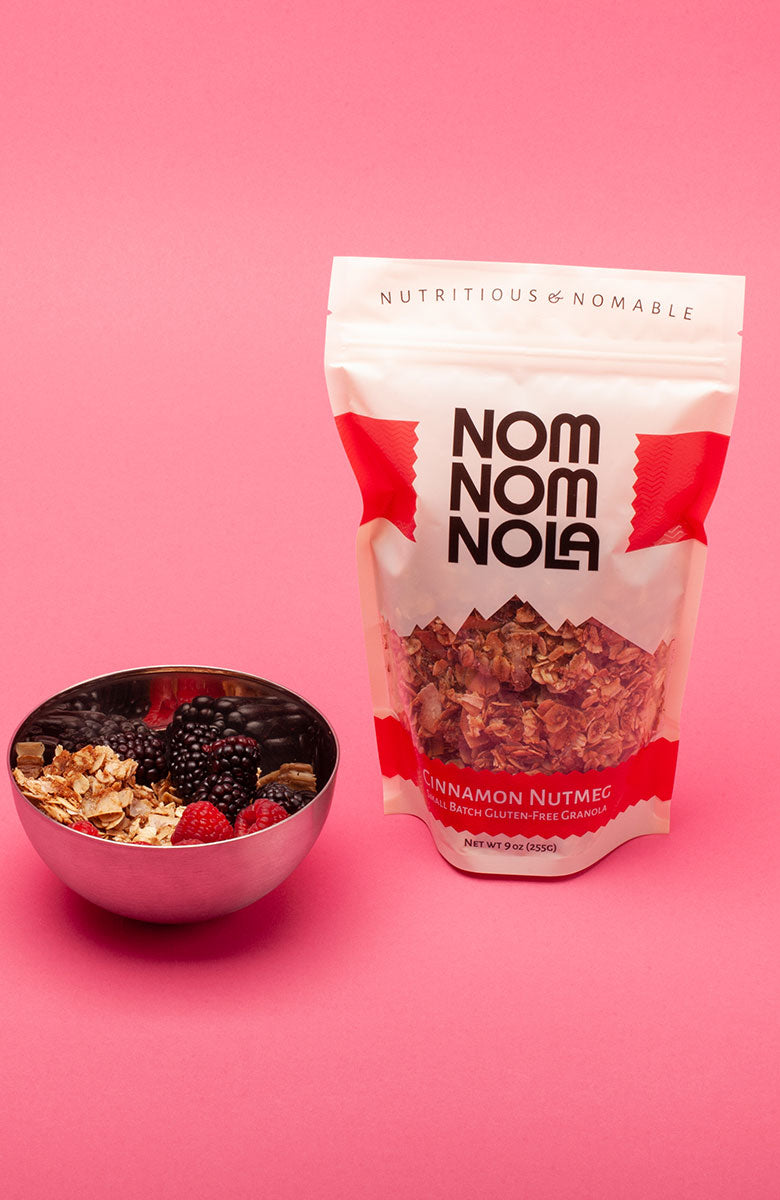 Cinnamon Nutmeg Nom Nom Nola Granola next to Acai bowl